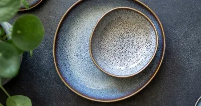 lave plates beige on a grey table
